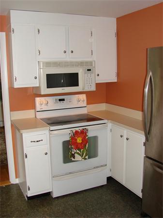 6 Buchan Road Andover, MA 01810 - Photo 8 of 12 a kitchen with white cabinets and white appliances