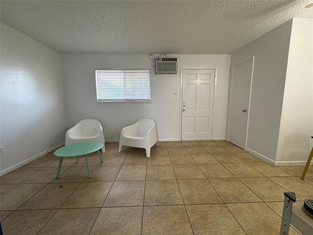 1415 Sewell Street, Unit 1 Abilene, TX 79605 - Photo 4 of 15 a bathroom with a toilet a sink and a mirror