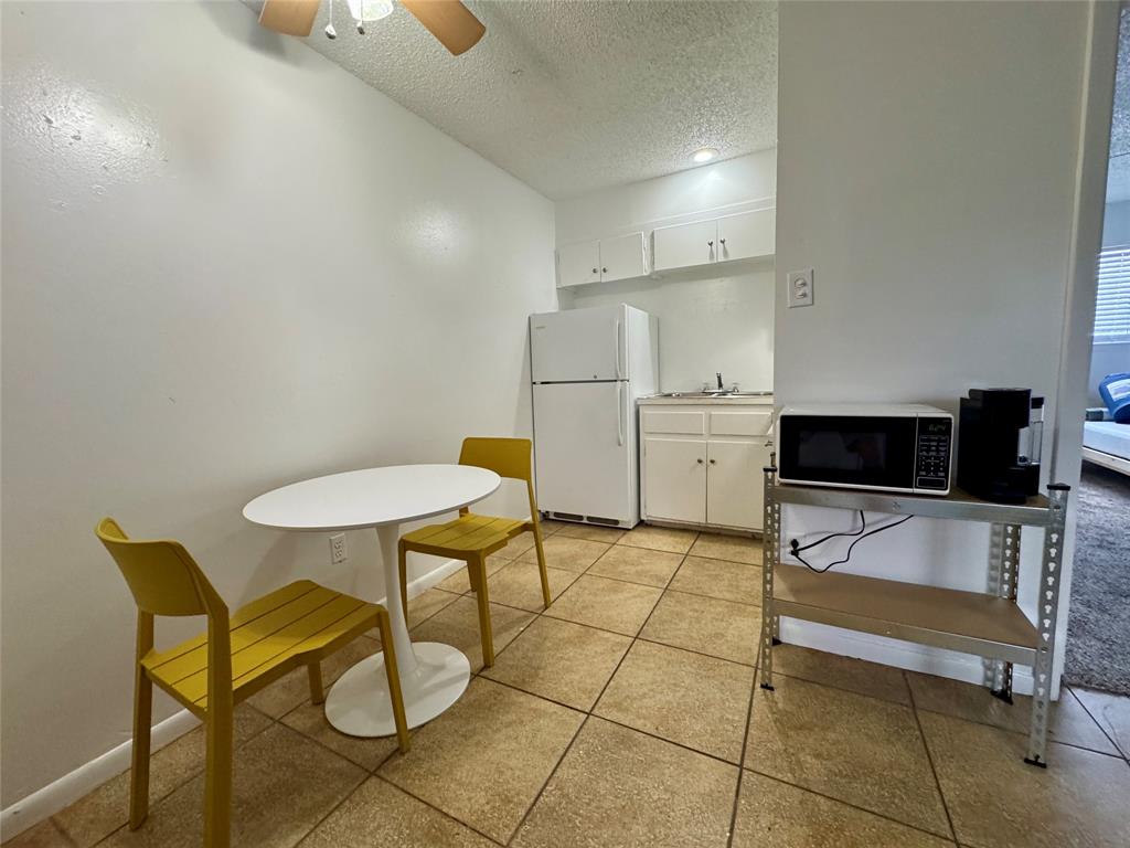1415 Sewell Street, Unit 1 Abilene, TX 79605 - Photo 6 of 15 a living room with furniture and a flat screen tv