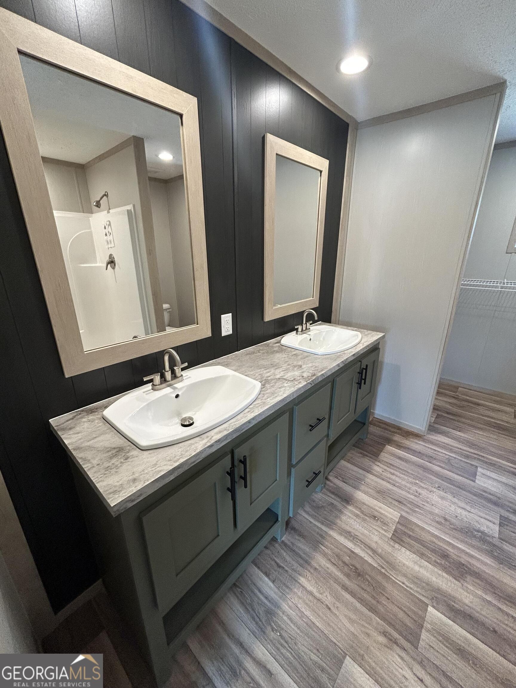640 Elmer Thrift Road Waycross, GA 31503 - Photo 16 of 23 a bathroom with a double vanity sink and a mirror