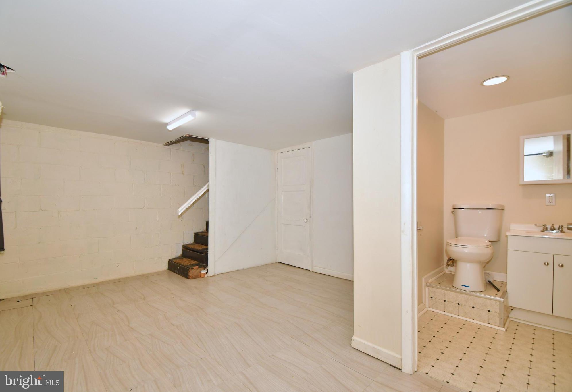 731 Roundview Road Baltimore, MD 21225 - Photo 28 of 40 a view of a bathroom with a sink and a toilet