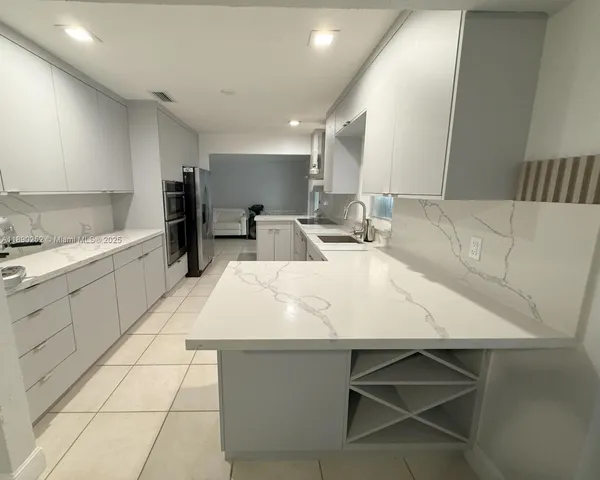 a bedroom with a bed and a mirror