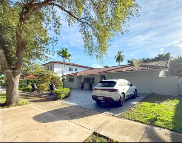 a car parked in front of a house