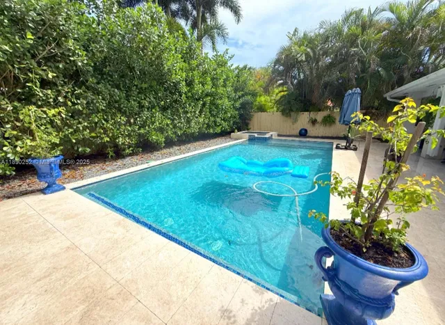 a view of a yard with table and chairs