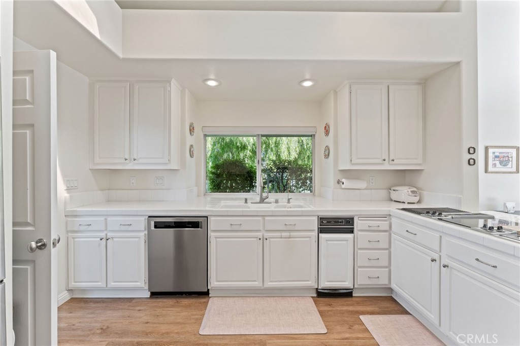 21 Centaurus Irvine, CA 92603 - Photo 19 of 65 a kitchen with cabinets appliances a sink and a window