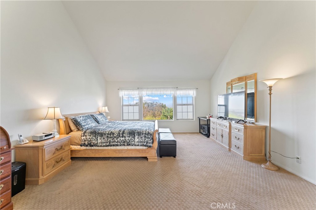 21 Centaurus Irvine, CA 92603 - Photo 29 of 65 a spacious bedroom with a bed and a couch