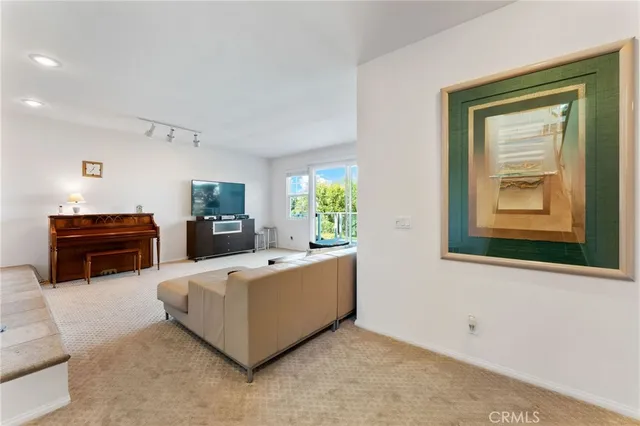 a view of a large building with a small yard and large trees