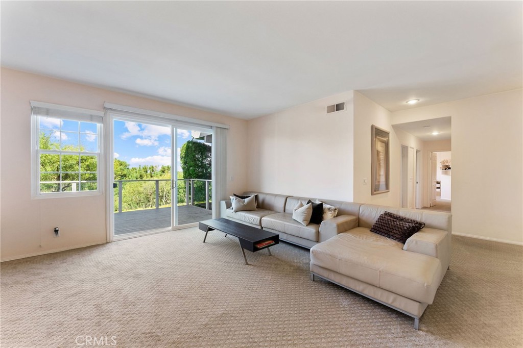 21 Centaurus Irvine, CA 92603 - Photo 37 of 65 a living room with furniture and a large window