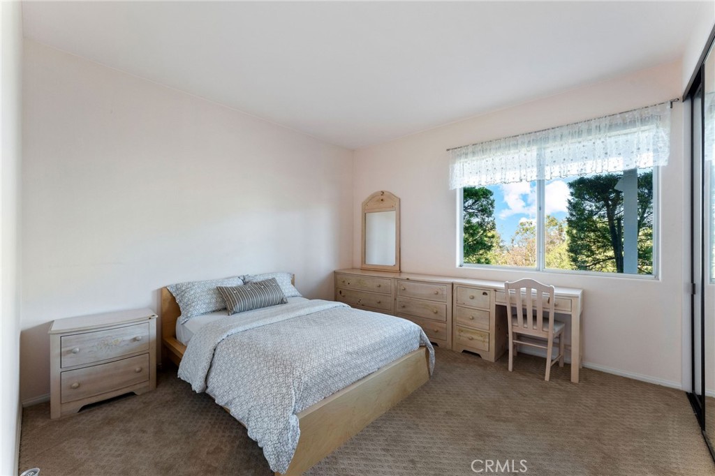 21 Centaurus Irvine, CA 92603 - Photo 40 of 65 a bedroom with a bed and a window