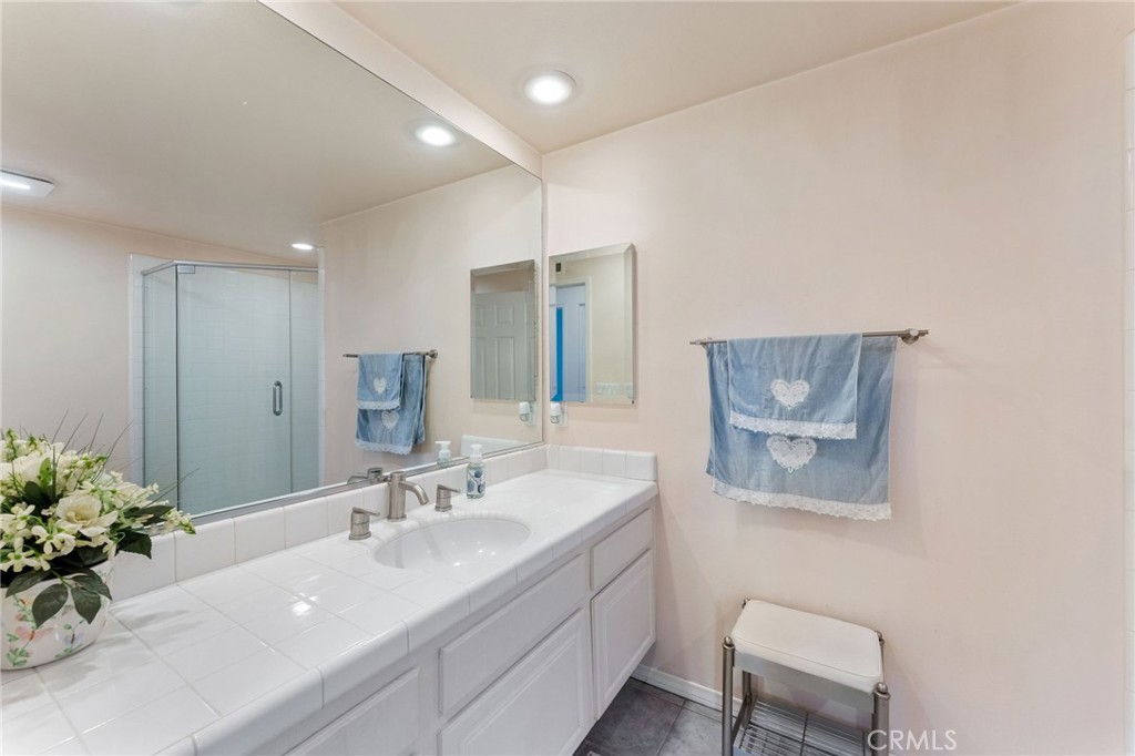 21 Centaurus Irvine, CA 92603 - Photo 42 of 65 a bathroom with a sink and a mirror