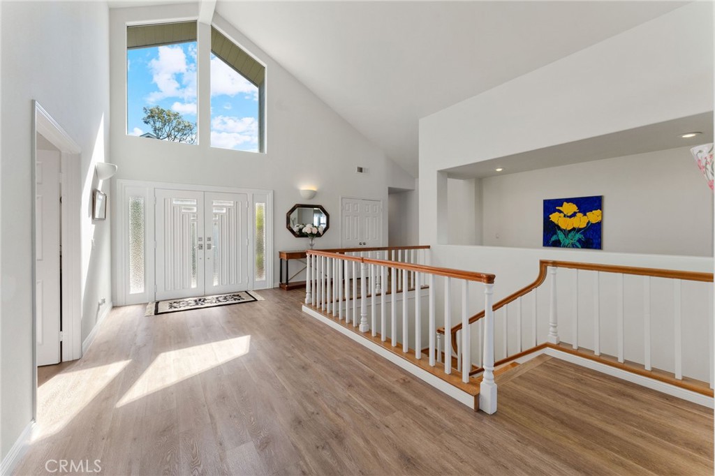 21 Centaurus Irvine, CA 92603 - Photo 9 of 65 a view of a hallway with wooden floor and windows