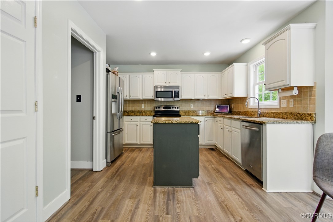 1360 Lomond Drive Midlothian, VA 23114 - Photo 6 of 33 With a pantry multiple cabinets, this kitchen has