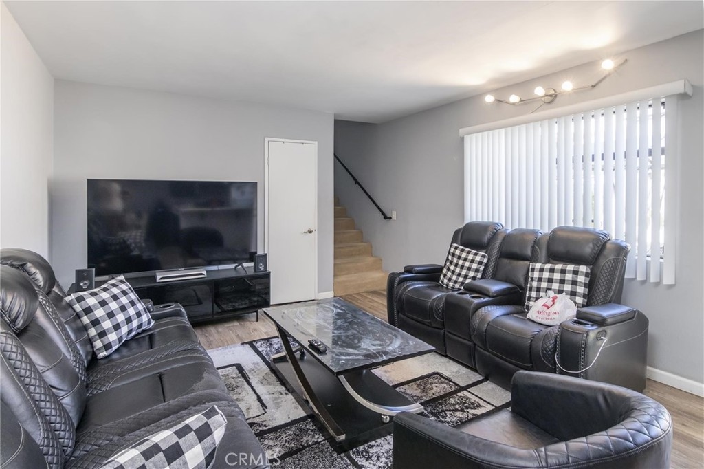 1031 Irving Avenue Glendale, CA 91201 - Photo 2 of 11 a living room with furniture and a flat screen tv