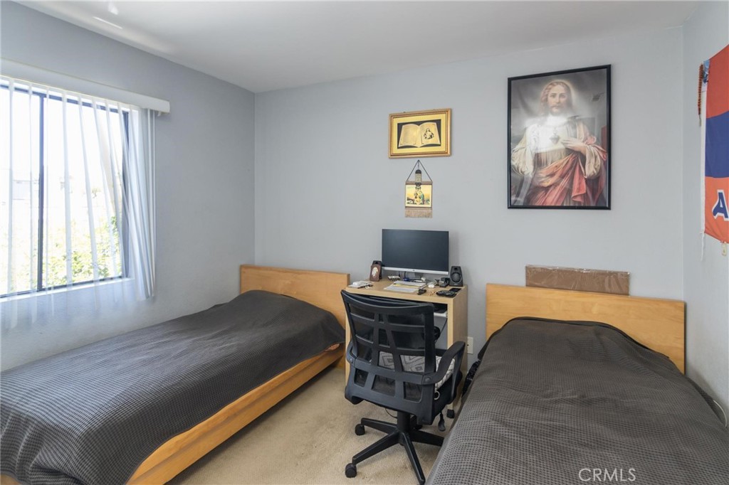 1031 Irving Avenue Glendale, CA 91201 - Photo 5 of 11 a bed room with a bed and a chair