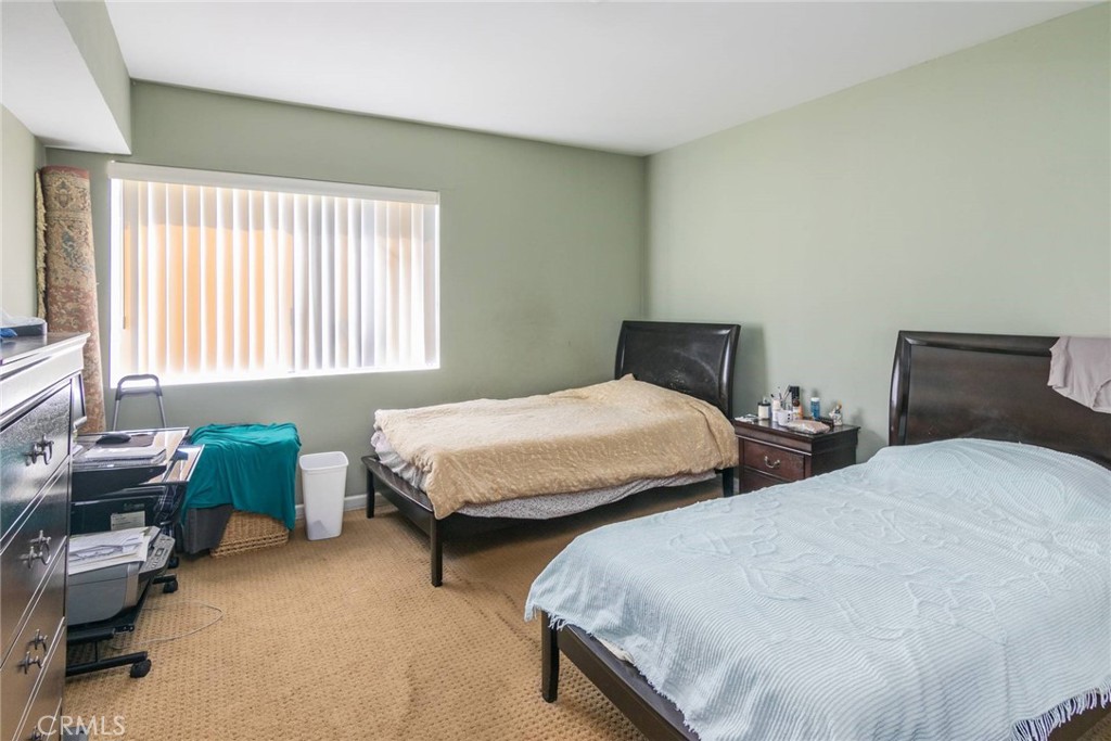 1031 Irving Avenue Glendale, CA 91201 - Photo 9 of 11 a bedroom with two beds and a window