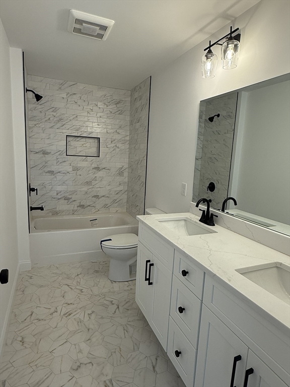 10 Muriel Way Rehoboth, MA 02769 - Photo 17 of 40 a bathroom with a double vanity sink toilet and shower