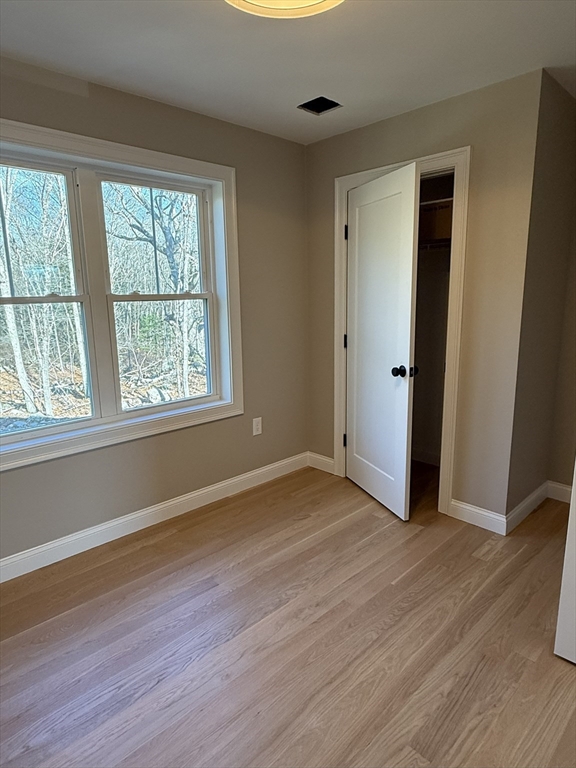 10 Muriel Way Rehoboth, MA 02769 - Photo 21 of 40 a view of an empty room with wooden floor and a window