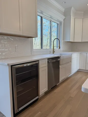 a stove top oven sitting inside of a kitchen