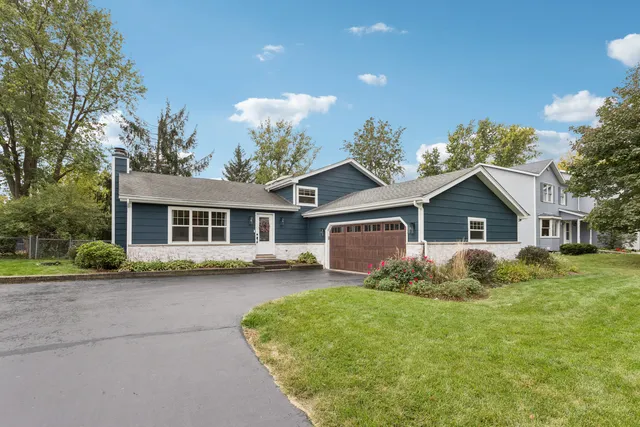 a front view of a house with yard