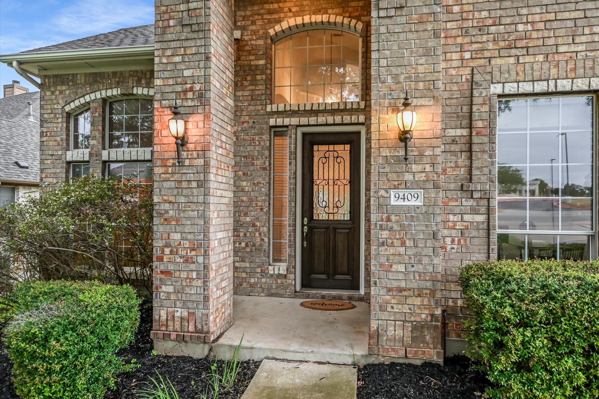 9409 Lisi Anne Drive Austin, TX 78717 - Photo 2 of 25 a front view of a building with brick walls