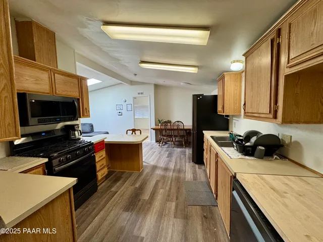 a kitchen with a stove and a microwave