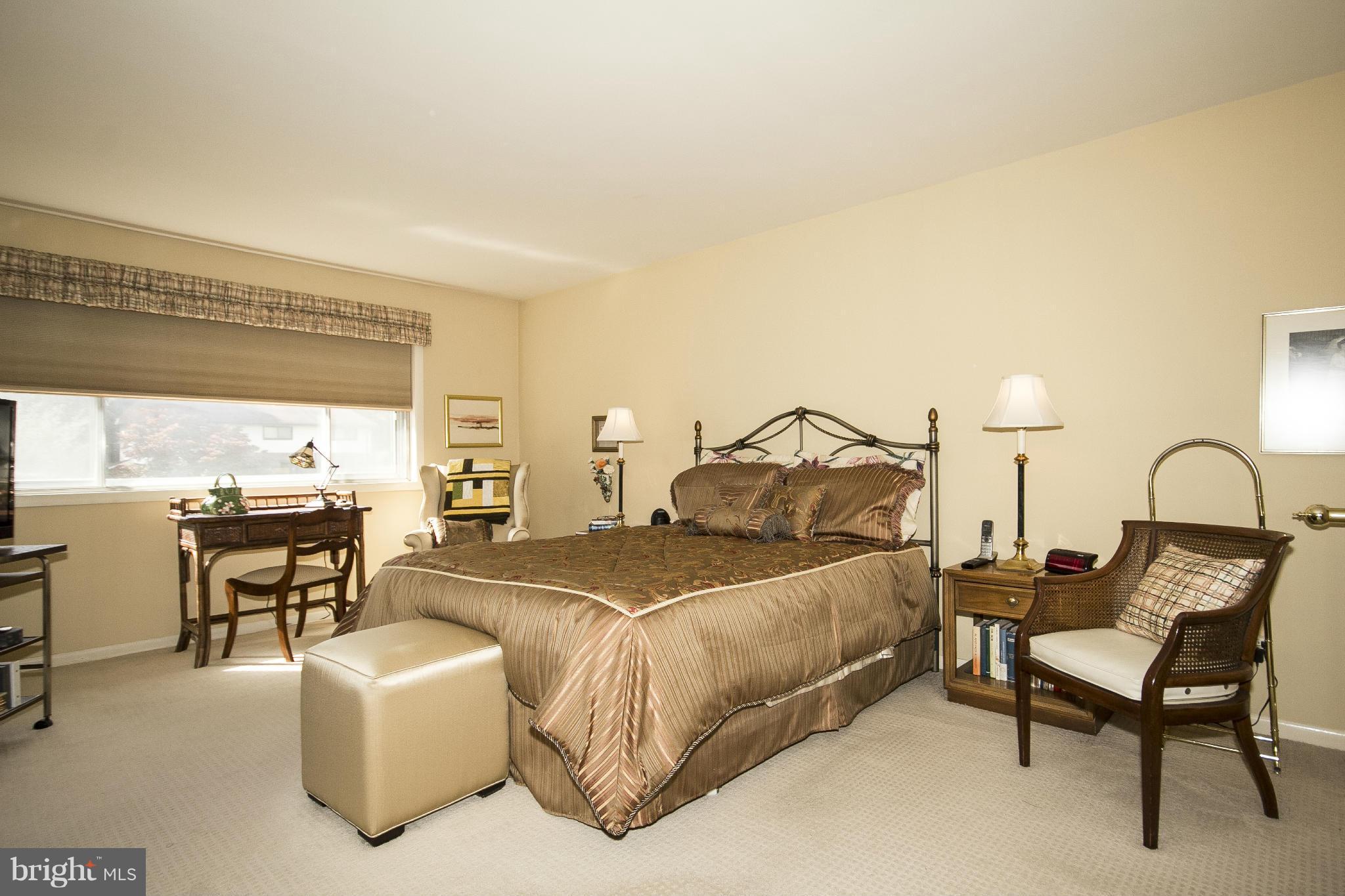 2208 Sugarcone Road Baltimore, MD 21209 - Photo 12 of 23 a bedroom with bed and a table