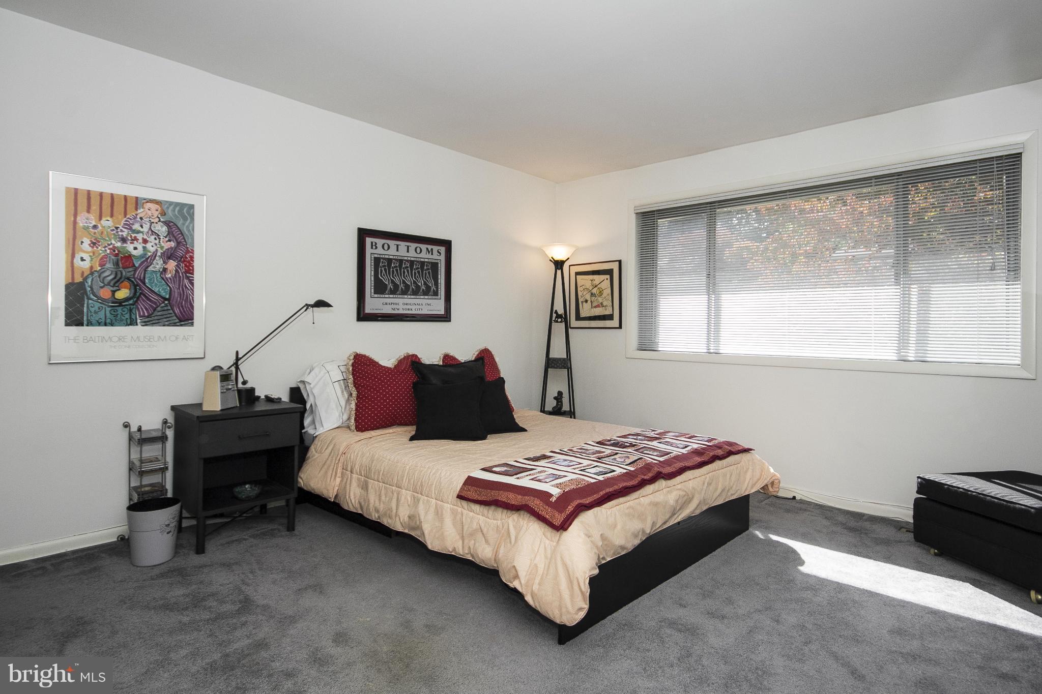 2208 Sugarcone Road Baltimore, MD 21209 - Photo 19 of 23 a bedroom with a bed and wooden floor