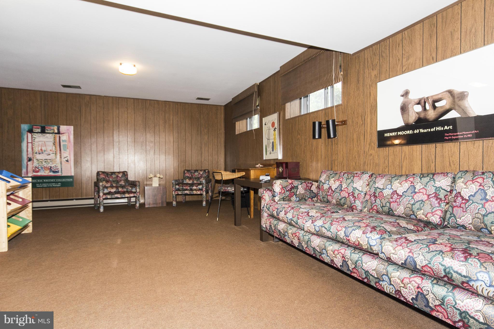 2208 Sugarcone Road Baltimore, MD 21209 - Photo 21 of 23 a living room with furniture and a couch