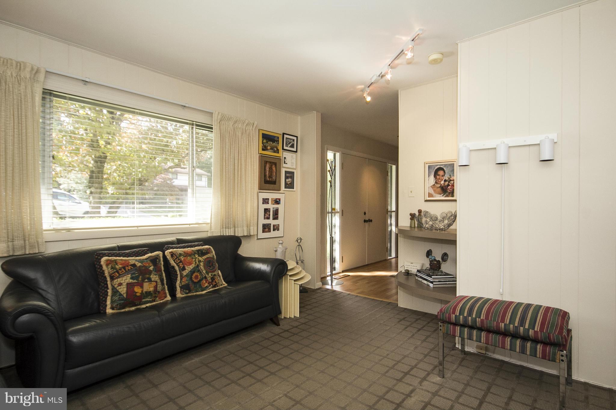 2208 Sugarcone Road Baltimore, MD 21209 - Photo 5 of 23 a living room with furniture and a window