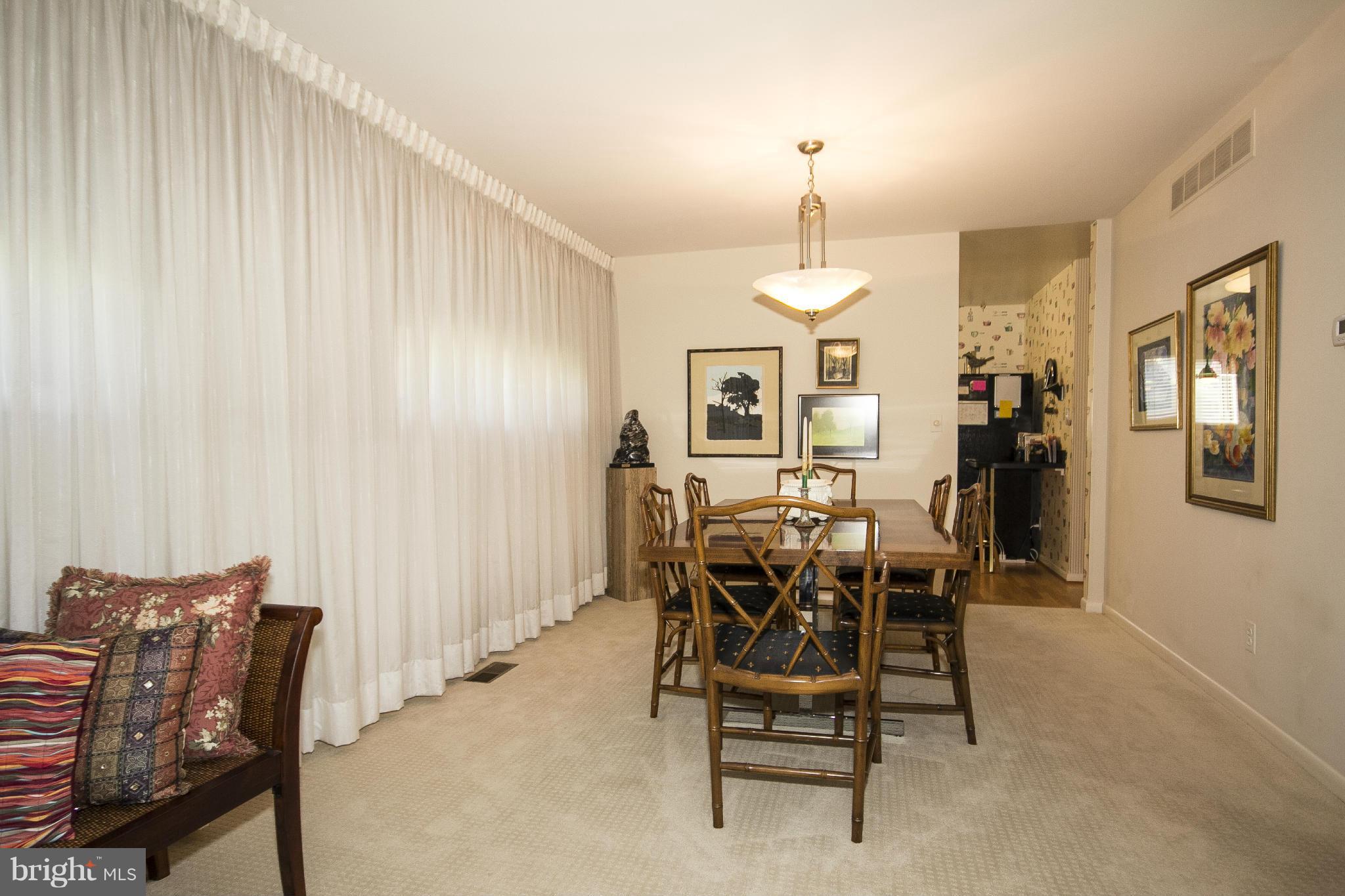 2208 Sugarcone Road Baltimore, MD 21209 - Photo 8 of 23 a view of a dining room with furniture and chandelier