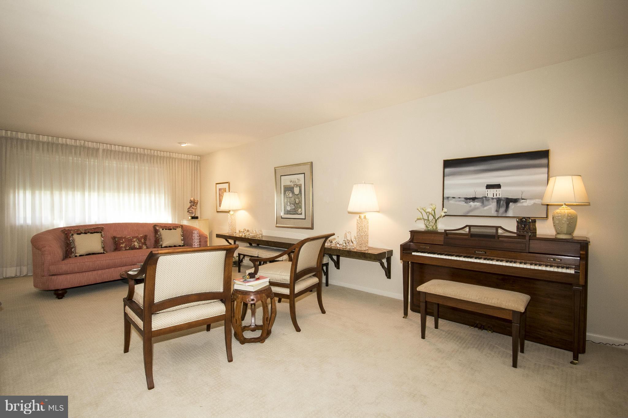 2208 Sugarcone Road Baltimore, MD 21209 - Photo 9 of 23 a living room with furniture and a piano