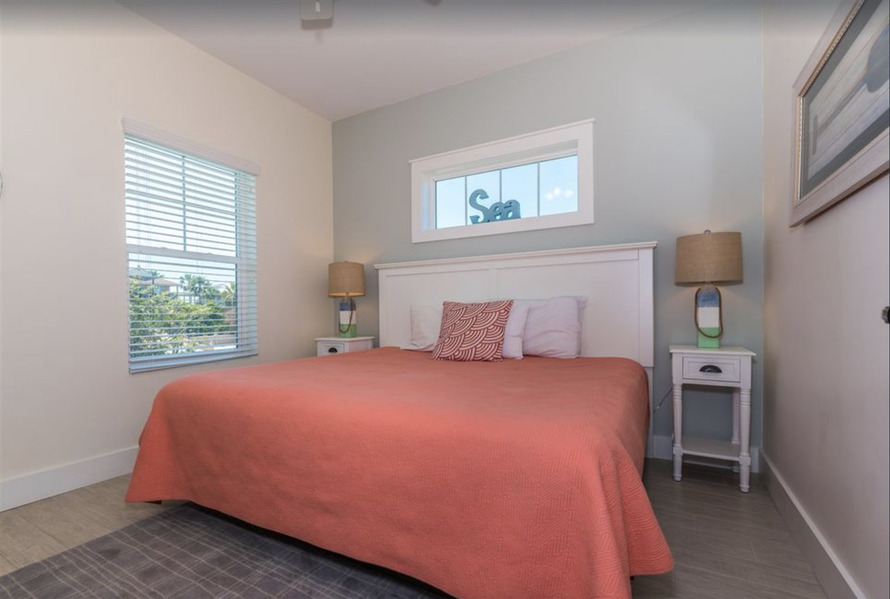 5349 Atlantic View St. Augustine, FL 32080 - Photo 21 of 33 a bedroom with a bed and a window