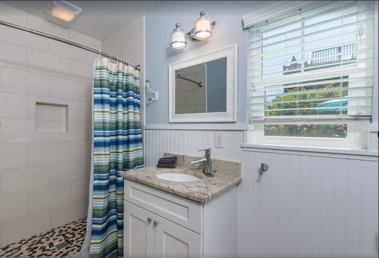 5349 Atlantic View St. Augustine, FL 32080 - Photo 26 of 33 a bathroom with a granite countertop sink and a window