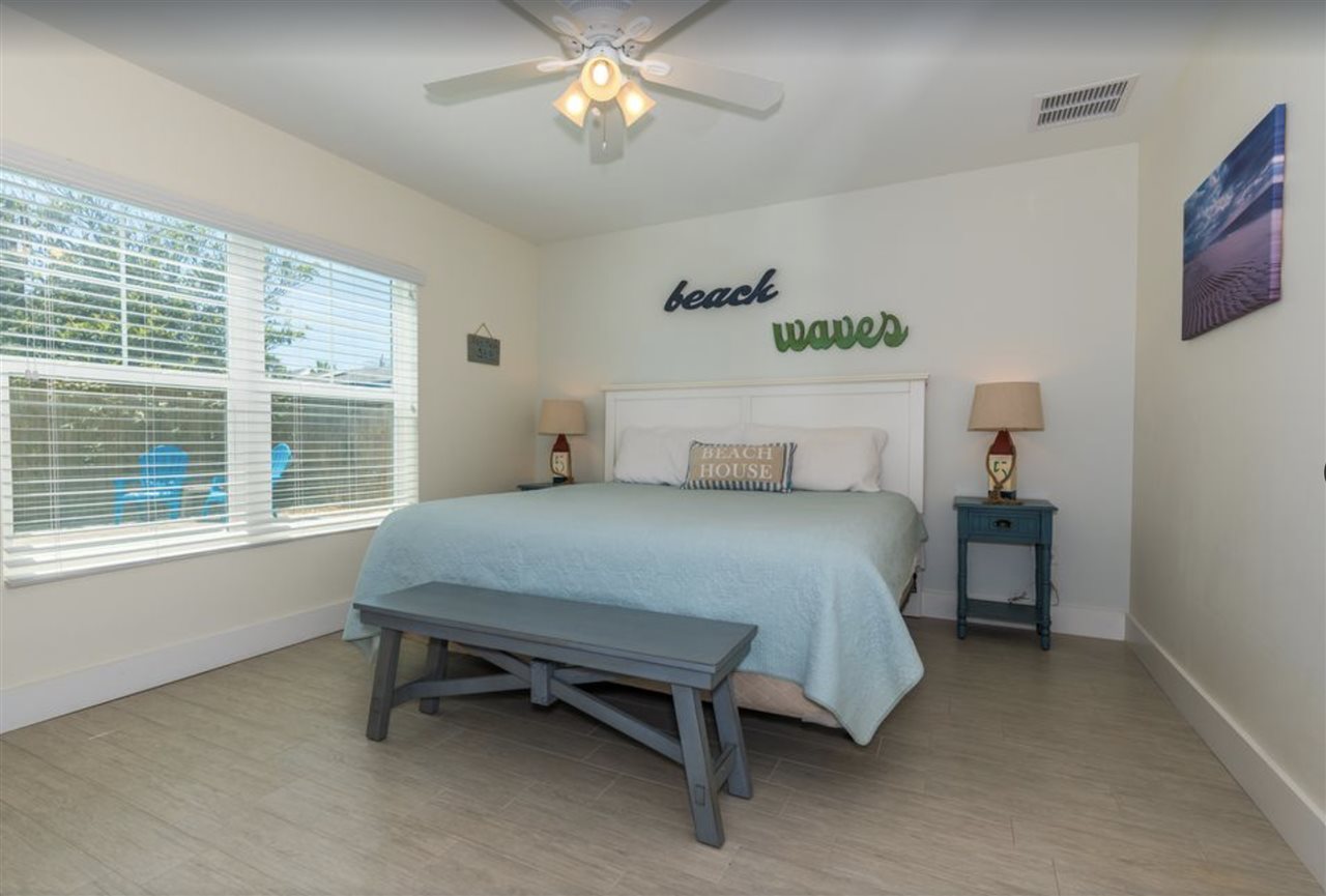 5349 Atlantic View St. Augustine, FL 32080 - Photo 27 of 33 a bedroom with a bed and a table