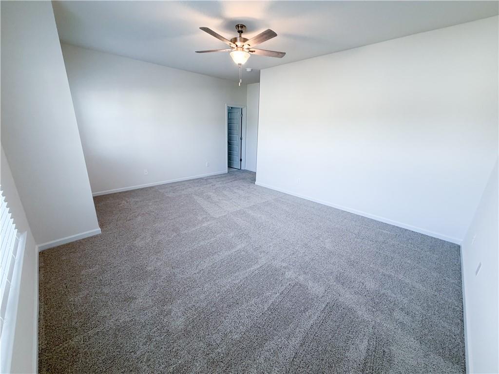 145 Red Oak Lane Calhoun, GA 30701 - Photo 13 of 18 a view of a big room with carpet