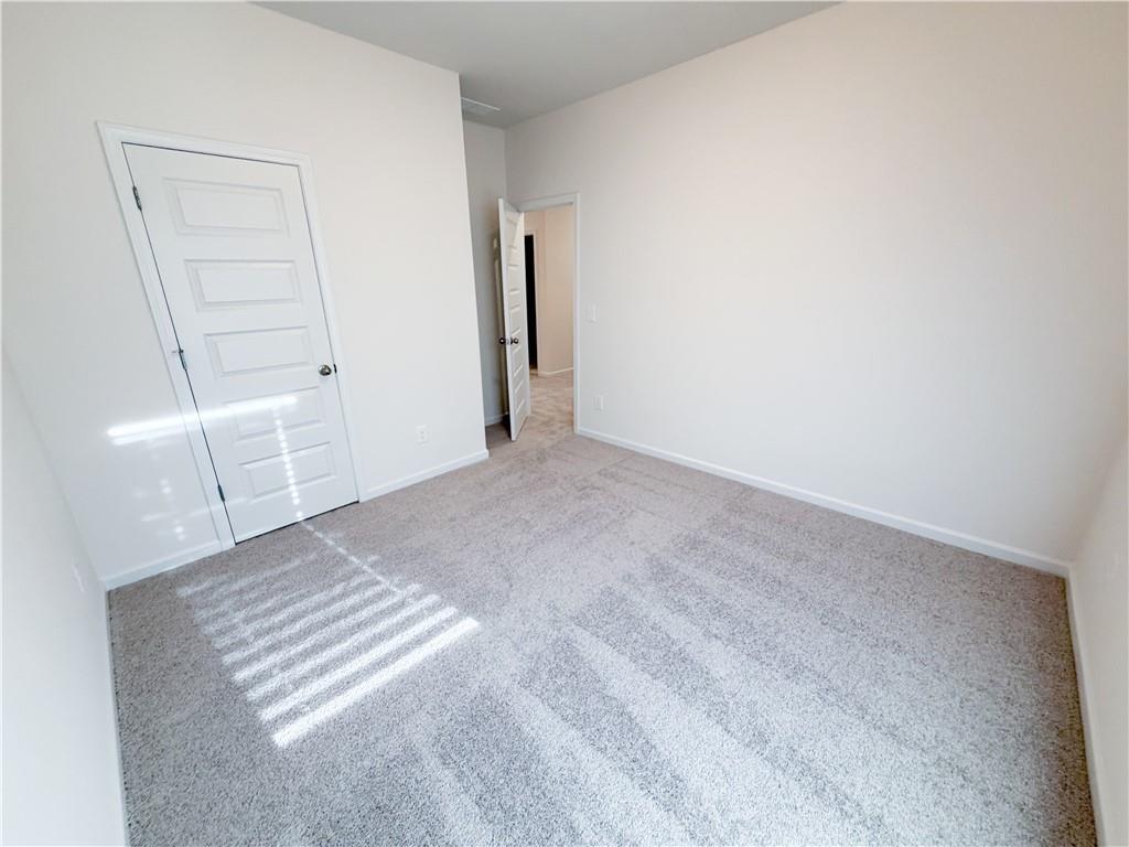 145 Red Oak Lane Calhoun, GA 30701 - Photo 8 of 18 an empty room with closet