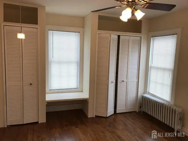 a view of balcony with wooden floor