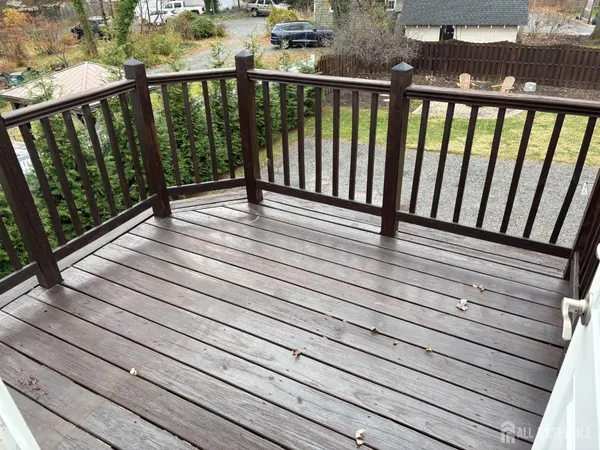 a view of a chairs and table on the deck