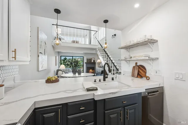 a kitchen with a sink and a refrigerator