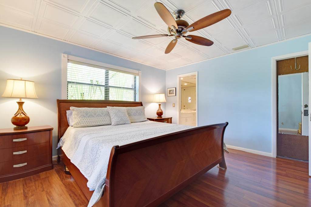 15429 Jupiter Farms Road Jupiter, FL 33478 - Photo 31 of 59 a bedroom with bed dresser and window