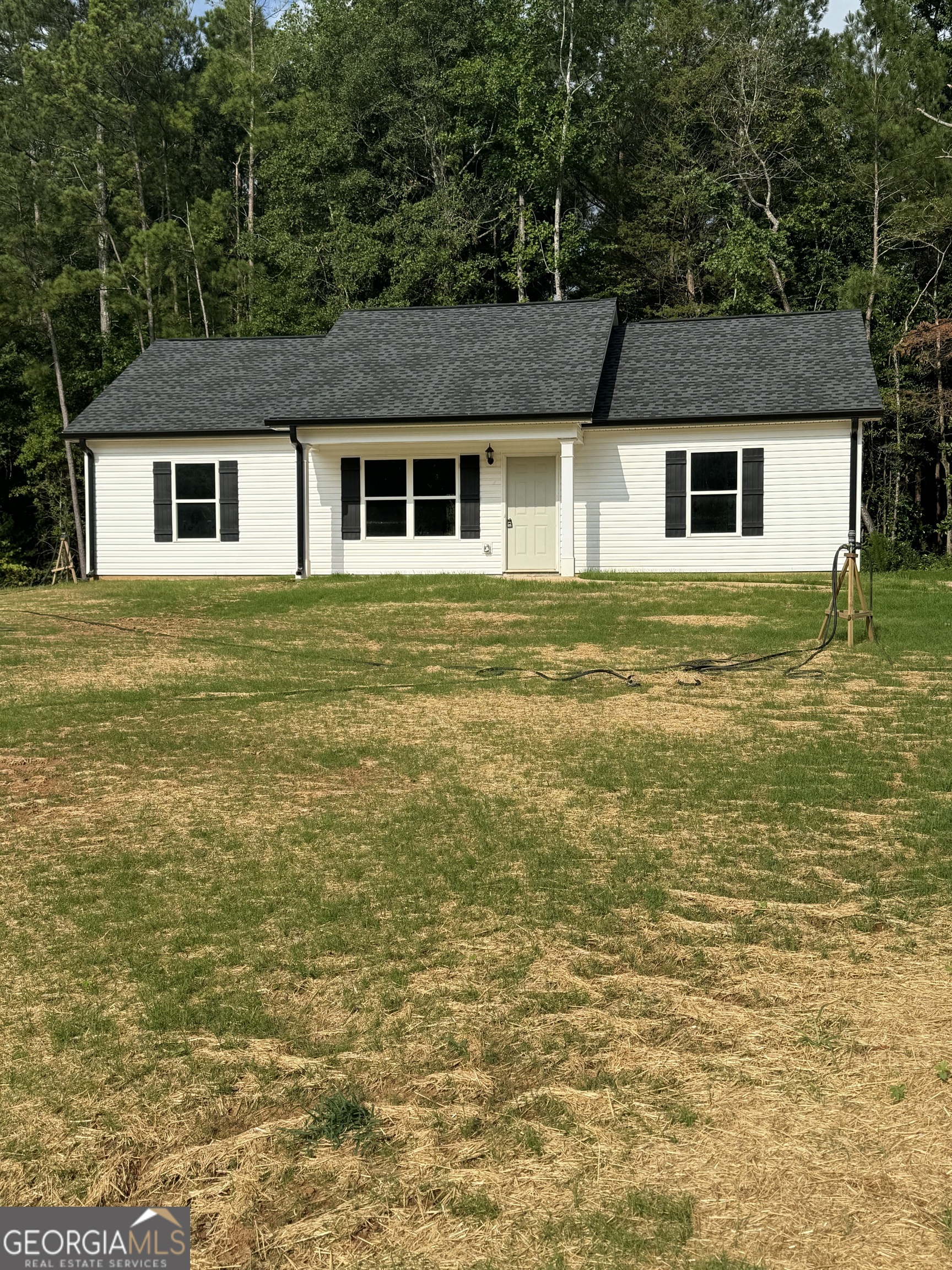 303 Spring Way Thomaston, GA 30286 - Photo 1 of 1 a front view of a house with a yard