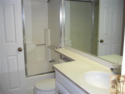 401 El Cielo Road, Unit 227 Palm Springs, CA 92262 - Photo 12 of 24 a bathroom with a sink a toilet and shower