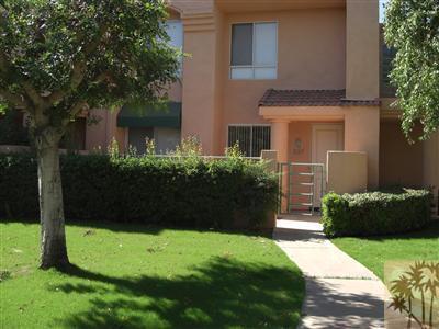 401 El Cielo Road, Unit 227 Palm Springs, CA 92262 - Photo 2 of 24 a front view of a house with a garden