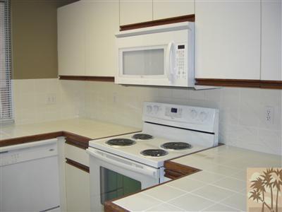 401 El Cielo Road, Unit 227 Palm Springs, CA 92262 - Photo 9 of 24 a view of washer and dryer