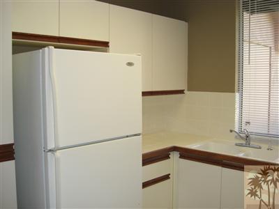 401 El Cielo Road, Unit 227 Palm Springs, CA 92262 - Photo 10 of 24 a white refrigerator freezer sitting inside of a kitchen