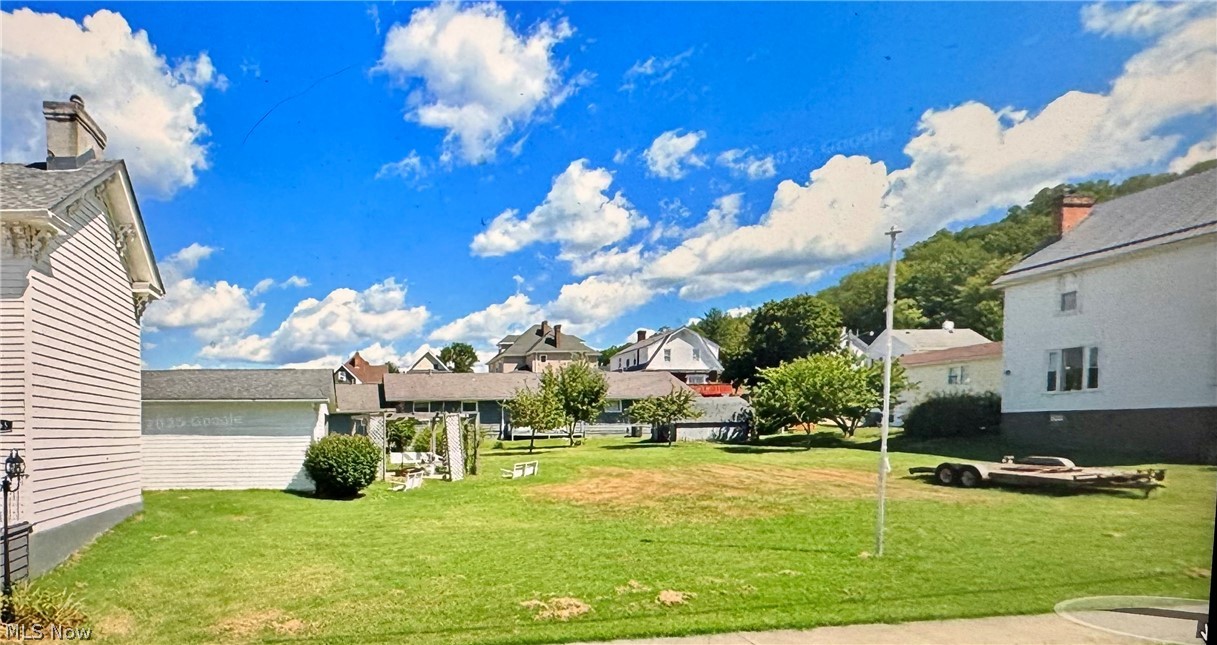 165 9th Street Wellsburg, WV 26070 - Photo 2 of 37 View of grassy yard with a residential view