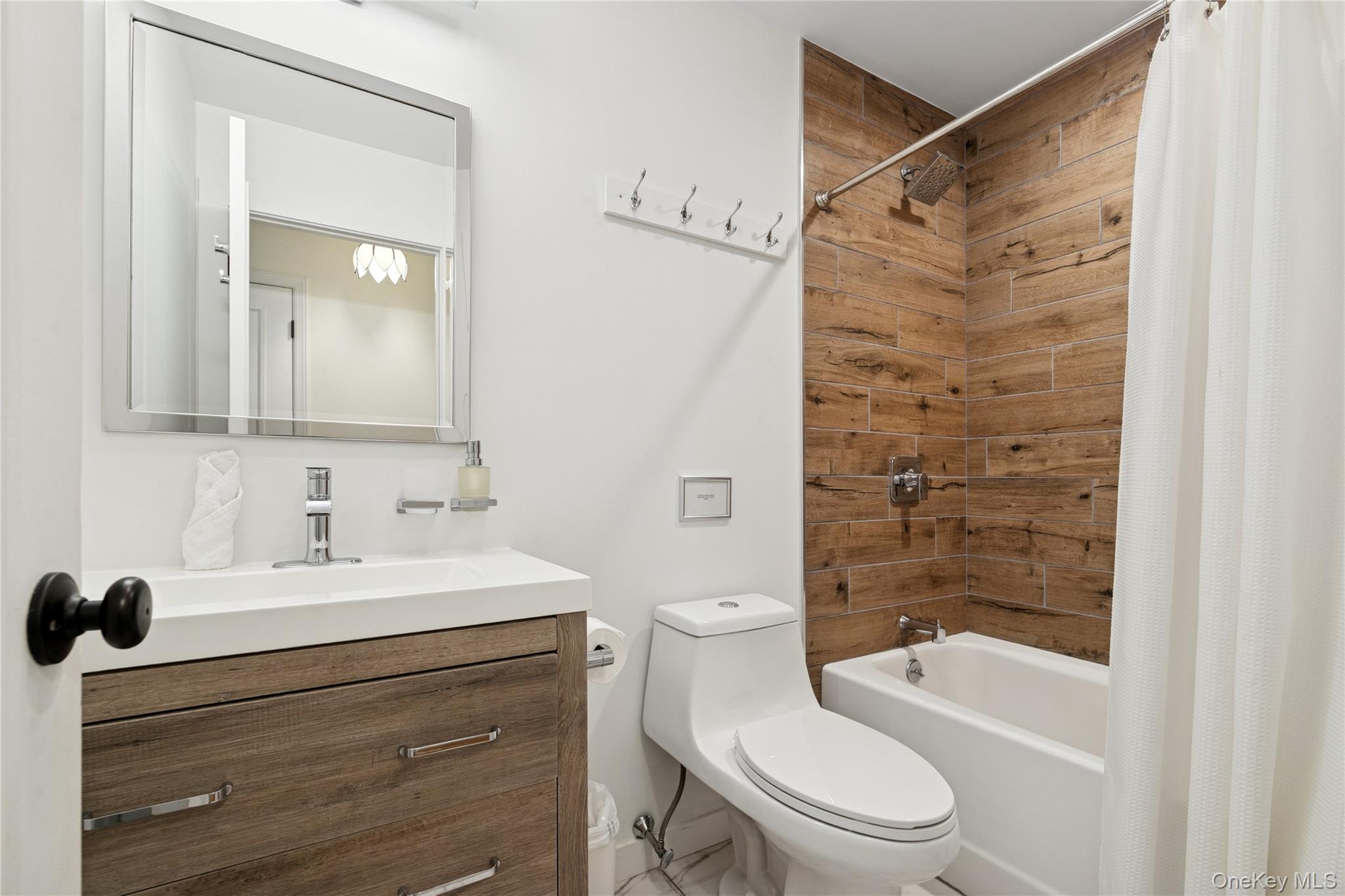 1181 Fireplace Road East Hampton, NY 11937 - Photo 12 of 26 a bathroom with a sink a toilet and shower