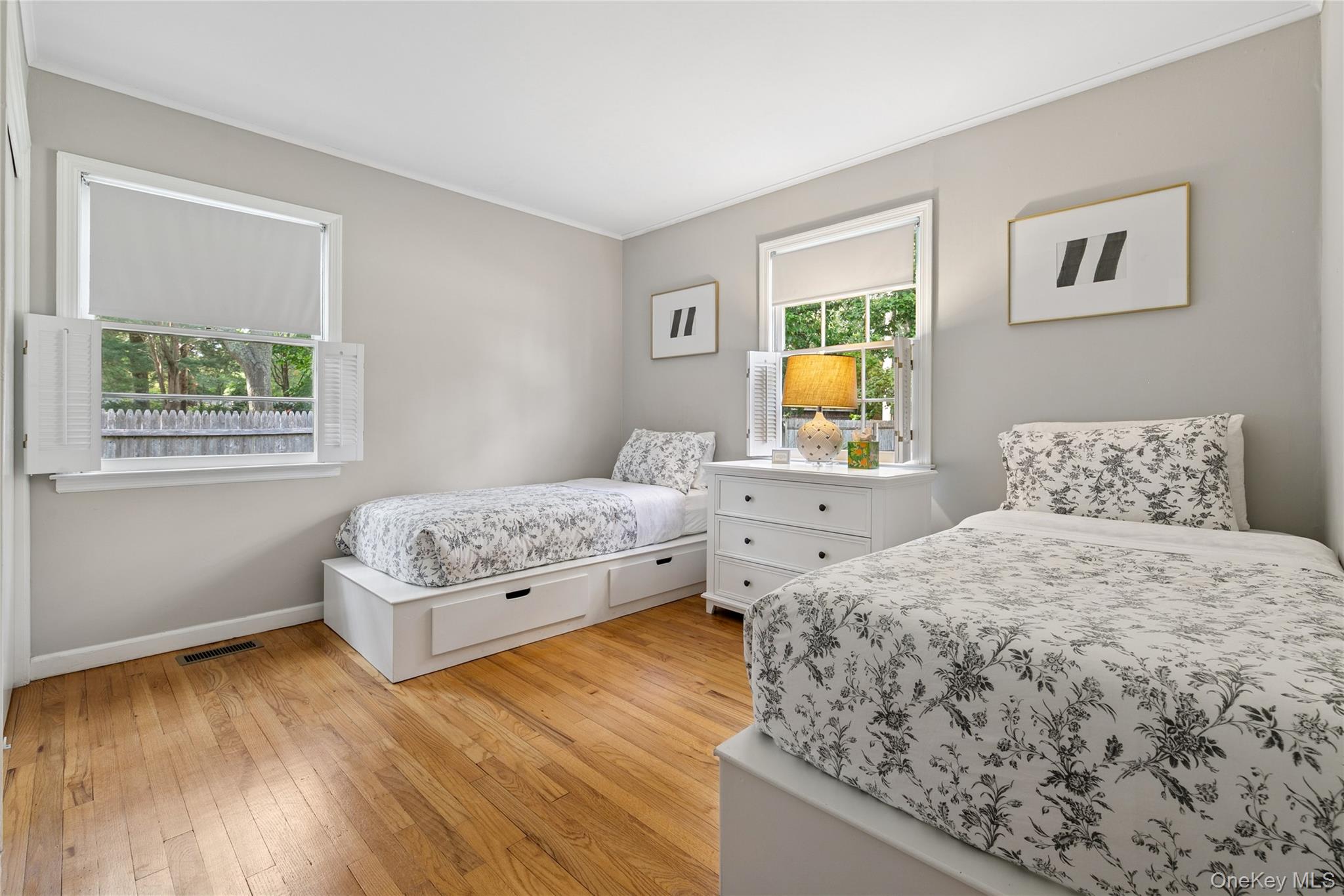 1181 Fireplace Road East Hampton, NY 11937 - Photo 14 of 26 a bedroom with a bed and wooden floor