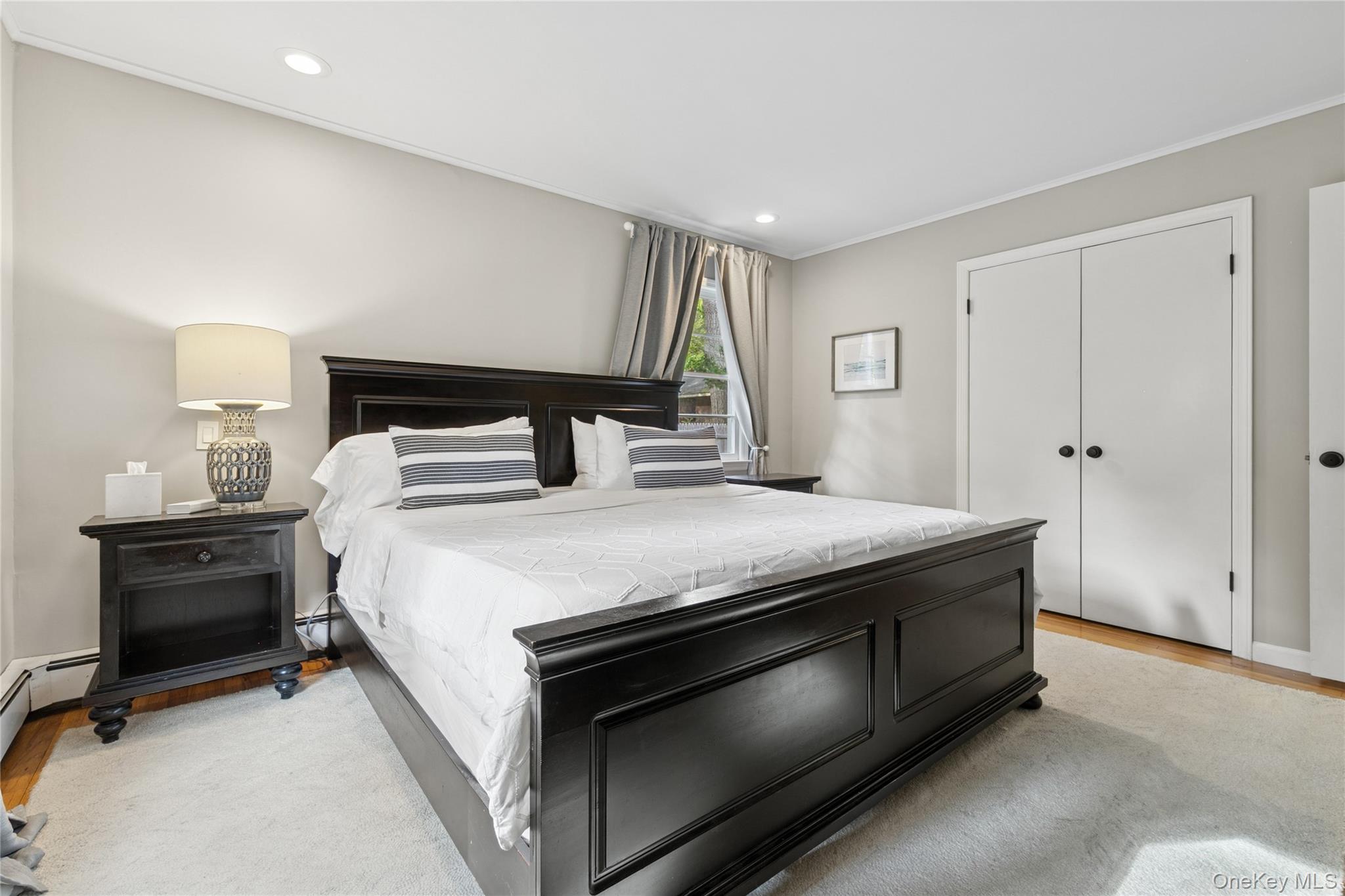 1181 Fireplace Road East Hampton, NY 11937 - Photo 17 of 26 a bedroom with a bed and a ceiling fan