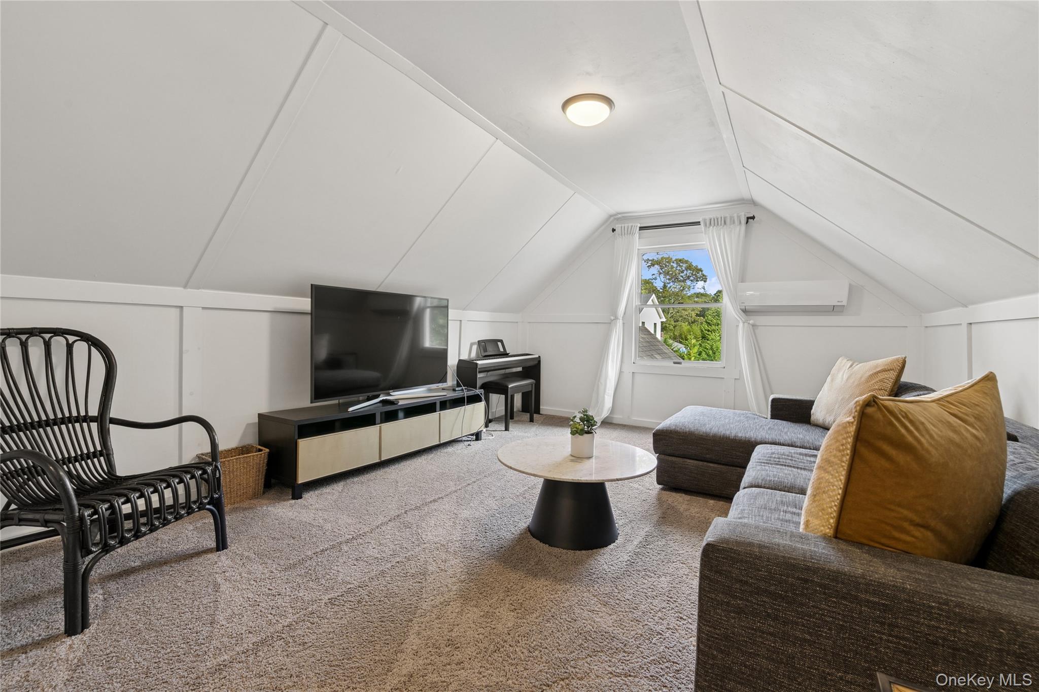 1181 Fireplace Road East Hampton, NY 11937 - Photo 19 of 26 a living room with furniture and a flat screen tv